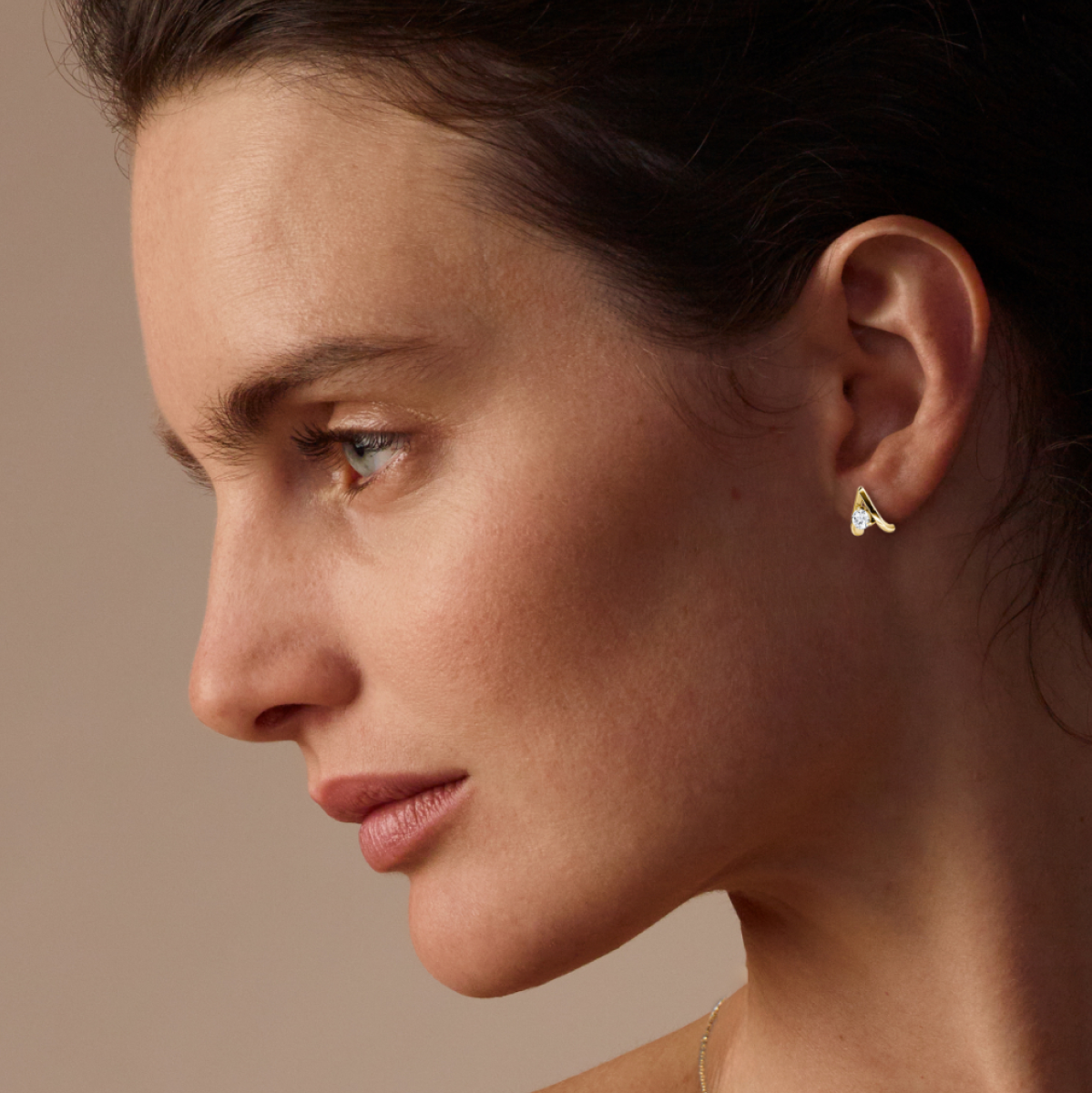 Women wearing VRAI created diamond Reversed V Stud