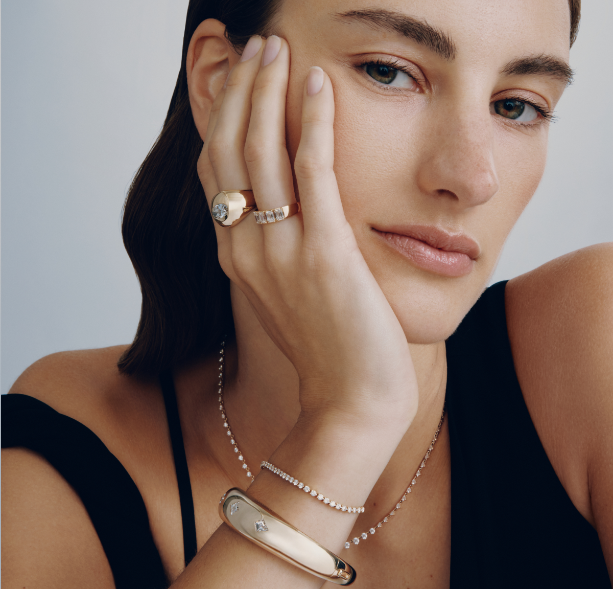 Image of woman wearing fine jewelry featuring VRAI created diamonds