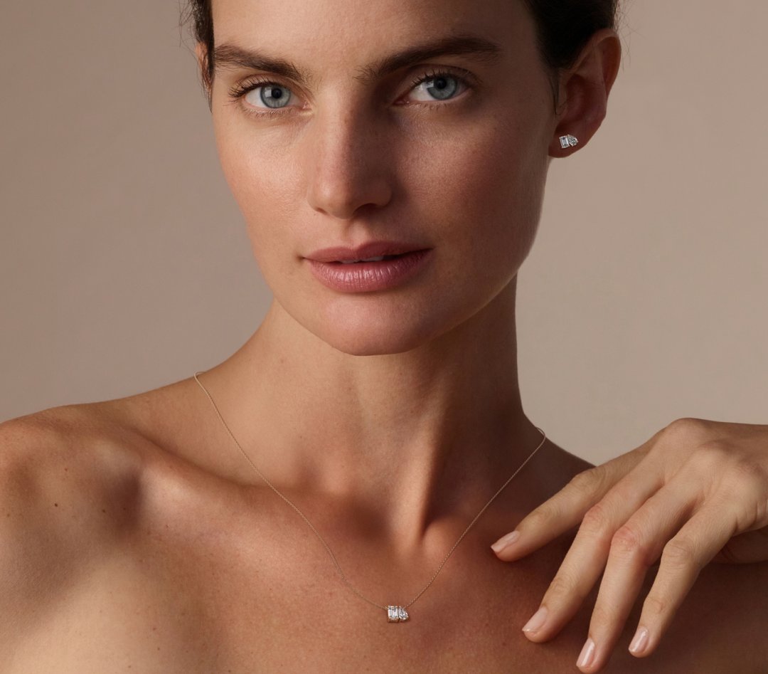 Image of model wearing Toi et Moi necklace and earrings made with VRAI created diamonds 