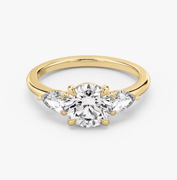 The Three Stone Round Brilliant Yellow Gold Engagement Ring